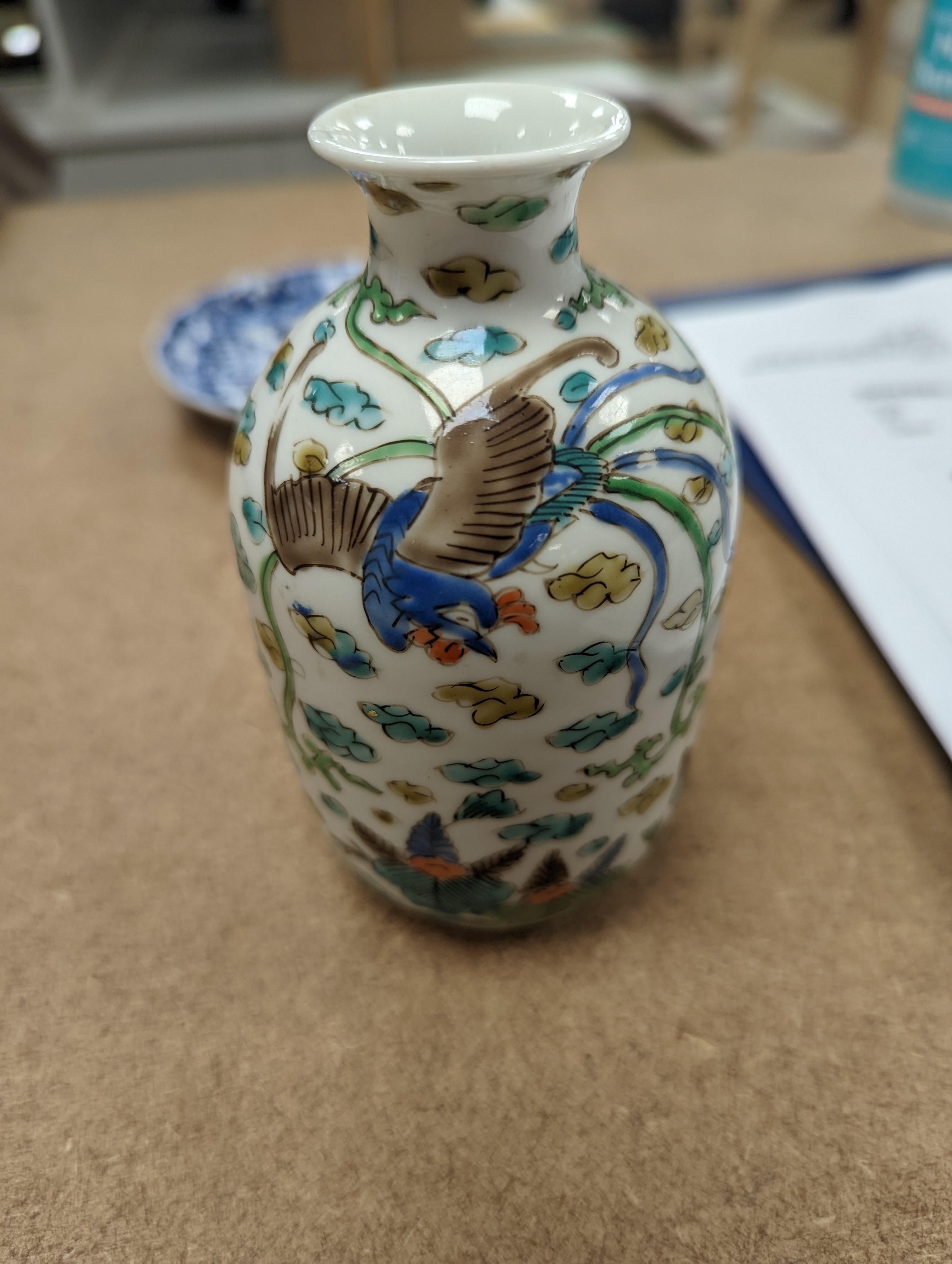 Two Chinese porcelain saucer dishes and an enamelled porcelain vase, 18th century and later, 12.5cm